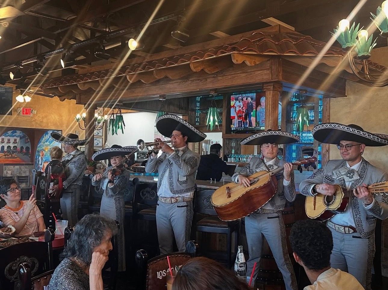 Mariachi band performing live at the grand opening